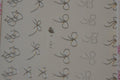 Autocollant Ongle Water Decal 25 petits Noeuds Argentés 107 - NailArtBoutique